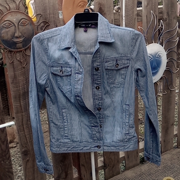 It's denim. Jackets & Blazers - Woman's  jacket size 10. Some stretch, but like no stretch.
